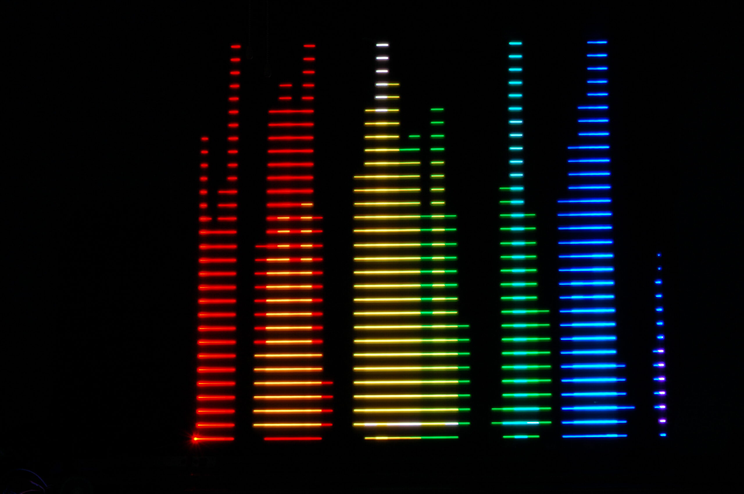 An image showing a colorful equalizer pattern generated by automatic light painting machine.
